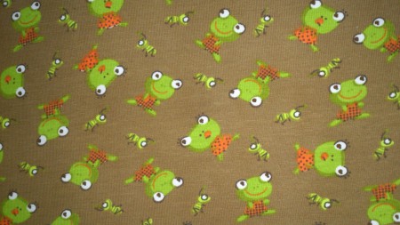 Brunt tyg med grodor/ figurer